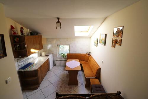 a kitchen with a sink and a table in it at Agroturystyka Tyniok in Koniaków