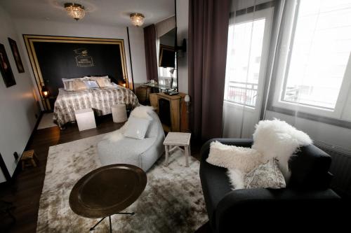 Postel nebo postele na pokoji v ubytování Boutique Hotel Mustaparta