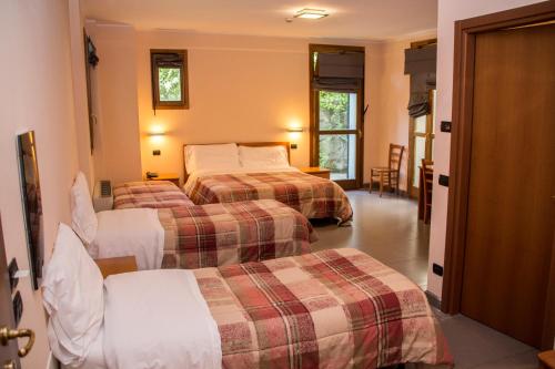 Кровать или кровати в номере Parini Hotel