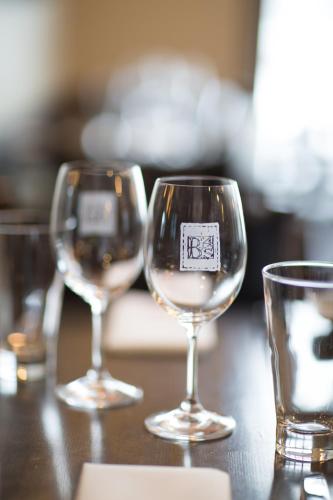 three wine glasses sitting on top of a table at Espace 4 Saisons in Magog-Orford