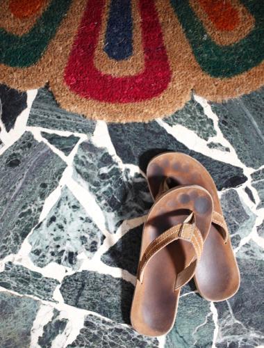 a pair of brown shoes sitting on a floor at SoloSonno in Lecco