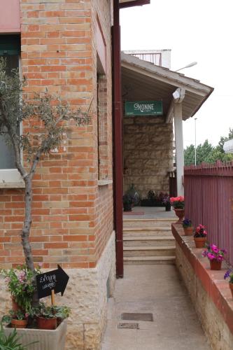 an entrance to a brick building with a sign on it at Le Chiocciole in Sannicandro di Bari