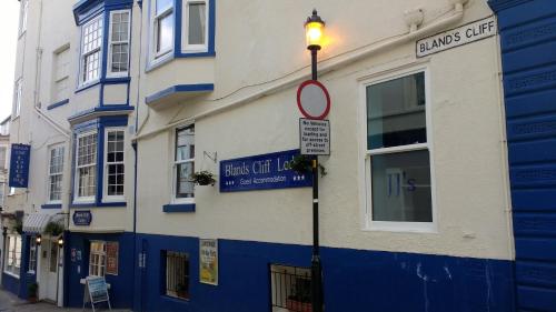 a street light in front of a blue and white building at Blands Cliff Lodge in Scarborough