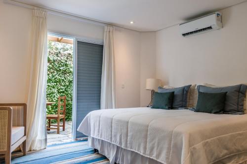 Cama ou camas em um quarto em Hotel Maui Maresias