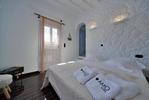 Postel nebo postele na pokoji v ubytování AMO Folegandros