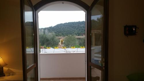 an open door to a balcony with a view at Il Sogno di Alghero - Adults Only in Alghero