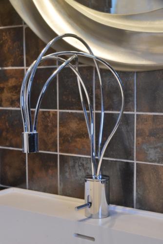 a metal mixer on top of a kitchen sink at AMO Folegandros in Karavostasi