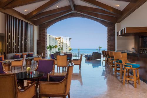 a restaurant with a view of the ocean at Krystal Grand Los Cabos - All Inclusive in San José del Cabo