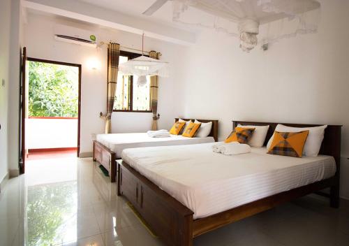 Säng eller sängar i ett rum på Hanthana Jungle View Holiday Home