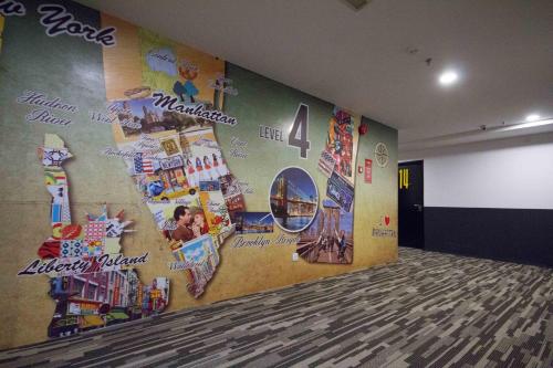 a room with a wall with stickers on it at Manhattan Hotel Ipoh in Ipoh