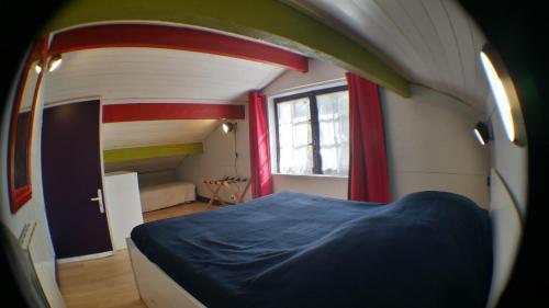 Ένα ή περισσότερα κρεβάτια σε δωμάτιο στο Maison Nature & Espace