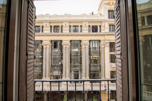 a view of a building from a window at Petit Palace Puerta del Sol in Madrid