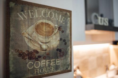 a picture of a coffee house sign on a wall at Gran Cancelliere B&B in Palermo