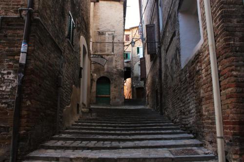 an alley in an old town with steep stairs at B&B Da Zia Ore in Iesi