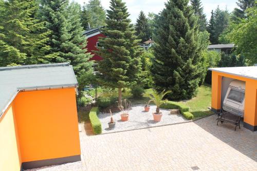 an overhead view of a garden with trees and a patio at Seaside Villa Leipzig in Leipzig