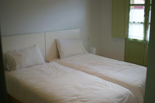 מיטה או מיטות בחדר ב-Las Casinas de la Granda