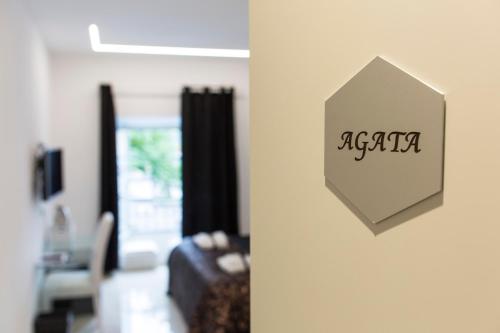 a sign on a wall in a living room at San Pietro Grand Suite in Rome