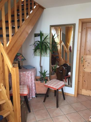 a room with a staircase and a mirror at Paulsberg-Lodge in Braunlage