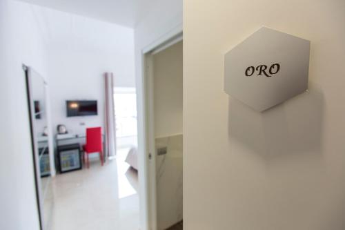 a door to a room with an oro sign on the wall at San Pietro Grand Suite in Rome