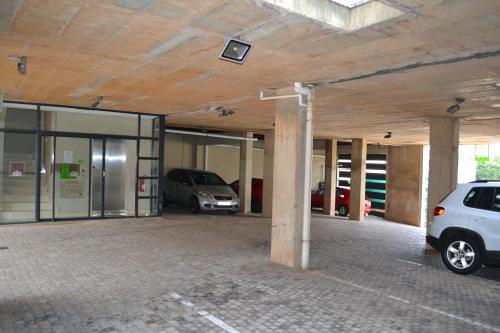a garage with two cars parked in it at Mesami Hotel in Durban