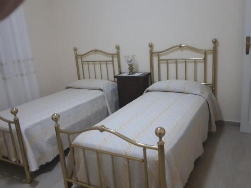 パチェーコにあるDatterinaのベッド2台が隣同士に設置された部屋です。