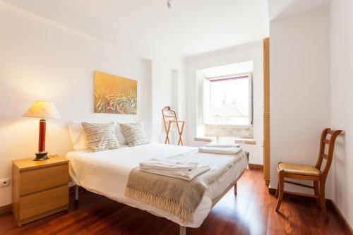 Ένα ή περισσότερα κρεβάτια σε δωμάτιο στο FLH Olivais Cozy Flat