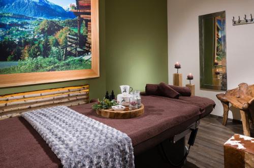 a bedroom with a bed and a view of a mountain at Berghotel Rehlegg in Ramsau