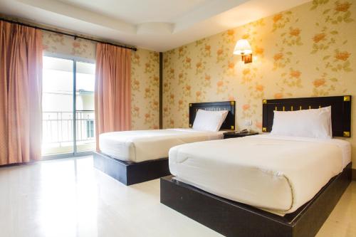 Posteľ alebo postele v izbe v ubytovaní Monrawee Pavilion Resort