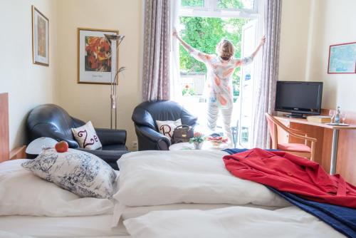 Телевизор и/или развлекательный центр в HotelHaus Ritter
