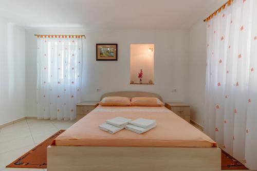 Posteľ alebo postele v izbe v ubytovaní Apartments Leila