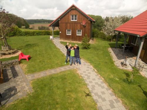 a group of people standing in front of a house at Hagwaldhof in Niederhofen