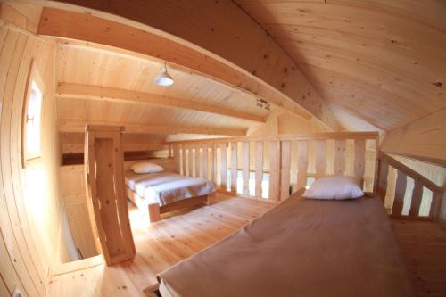 A bed or beds in a room at Cabanes et Lodges du Belvedere