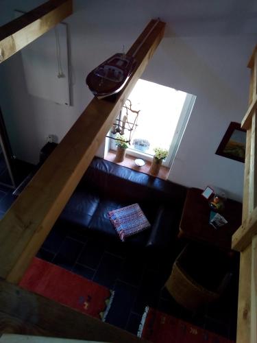 an overhead view of a living room with a wooden staircase at Bootshaus in Eisenstadt