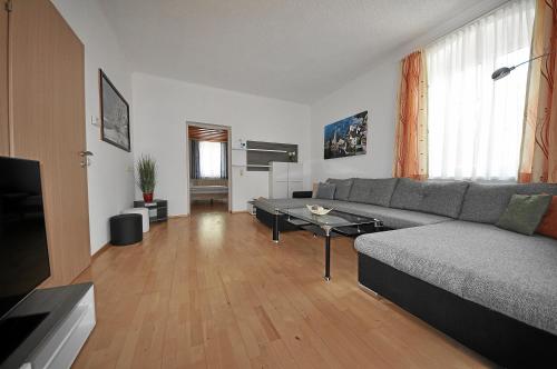 a living room with a couch and a table at Apartements Wallner in Hallstatt