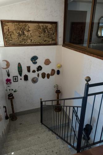 a room with a staircase with a painting on the wall at Sul Golfo in Formia