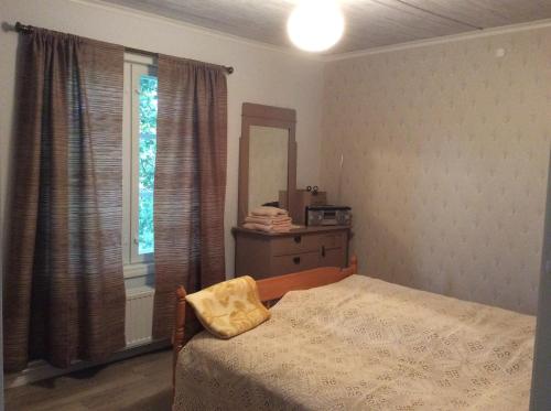 Giường trong phòng chung tại Siirilän tila