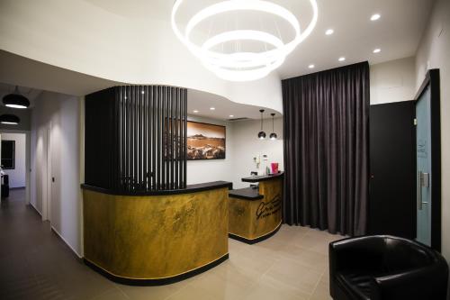 a lobby with a reception desk in a building at Gramsci 21 Rooms in Naples