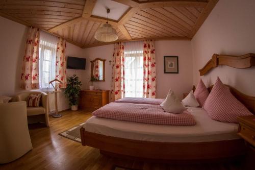 a bedroom with a large bed in a room at Weingut Stoff in Kitzeck im Sausal