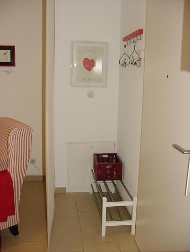 a hallway with a room with a red heart on the wall at Apartment Am Markt 13 in Konz