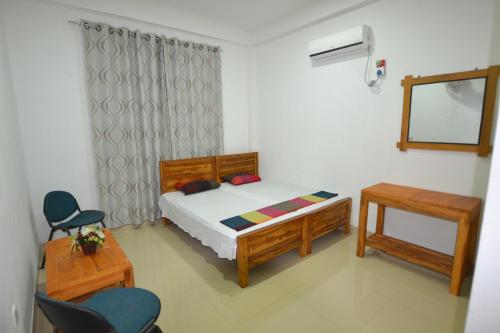 A bed or beds in a room at A&B Events Guest