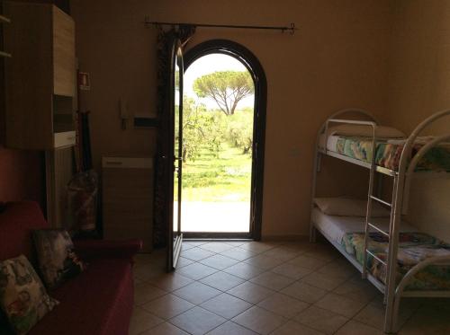 an open door to a room with bunk beds at Il Girasole B&B in Cretone