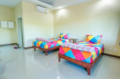 Ένα ή περισσότερα κρεβάτια σε δωμάτιο στο Ariya Garden Home