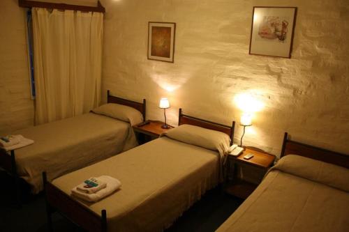 Säng eller sängar i ett rum på Hotel La Fundacion