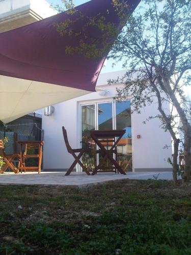 a picnic table sitting outside of a house at Bedrooms B&B in Pescara