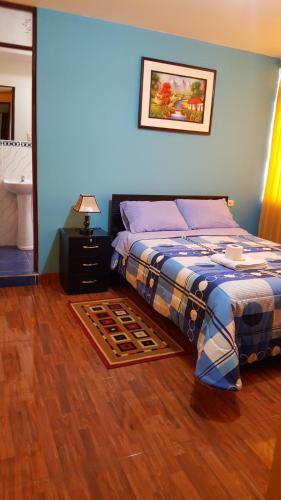 Postel nebo postele na pokoji v ubytování Hostal Los Pinos