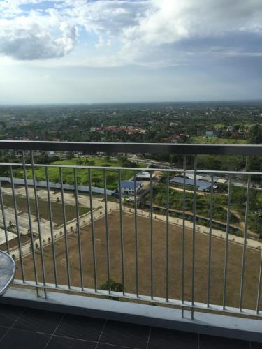 a view from the balcony of a building at 05-06 at Wind Residences Tagaytay in Tagaytay