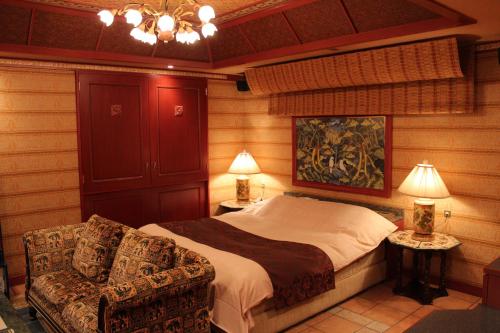 Кровать или кровати в номере Hotel LaLa (Adult Only)