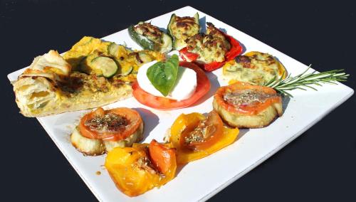 a white plate with different types of vegetables on it at L'Oasi del Rossese in Dolceacqua