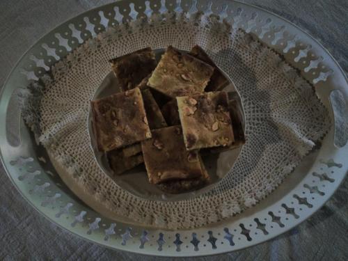 a plate of brownies sitting on a table at Kadi in Tsepelovo