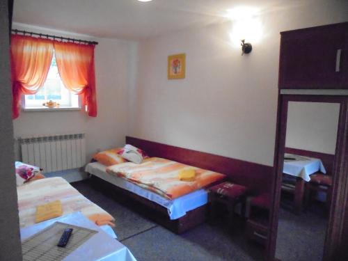 A bed or beds in a room at Agroturystyka Krysia Pilszcz